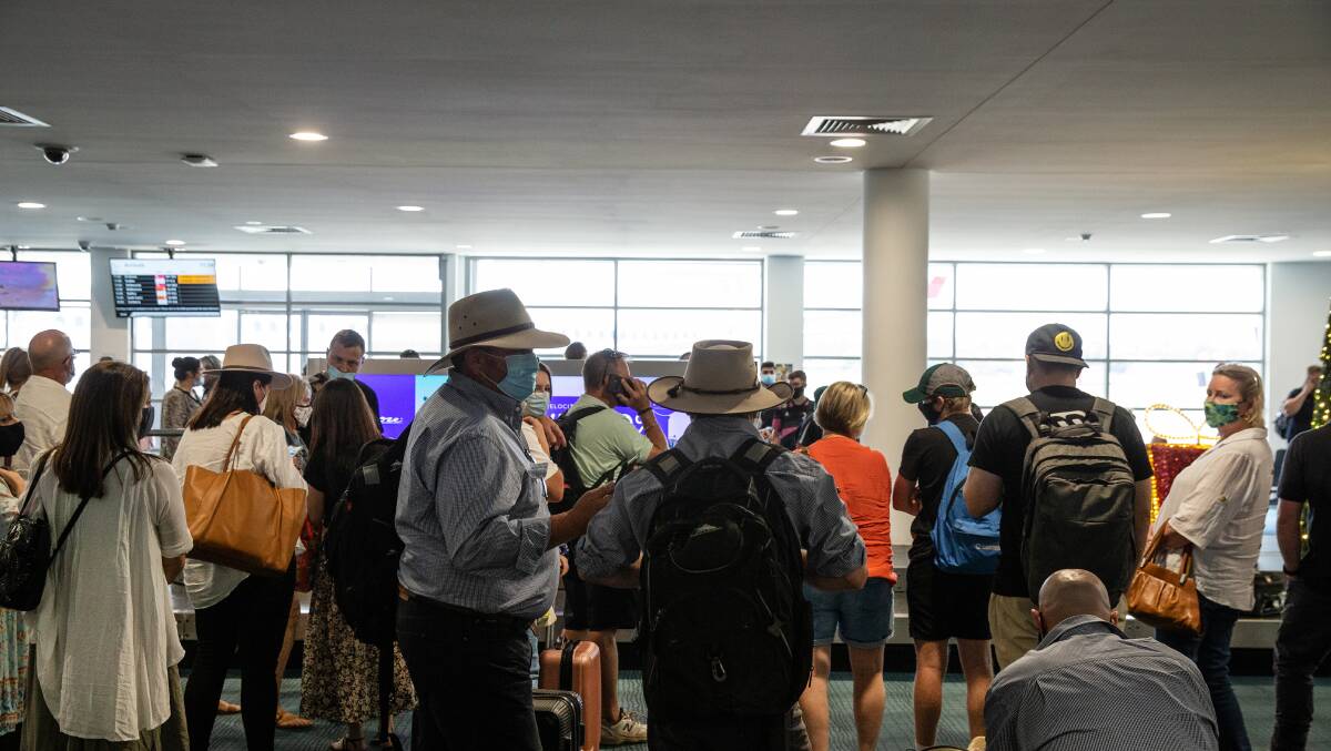 GOOD DAY: Crowds at Newcatle Airport after flights from Brisbane resumed in December last year after a COVID halt. Picture: Marina Neil