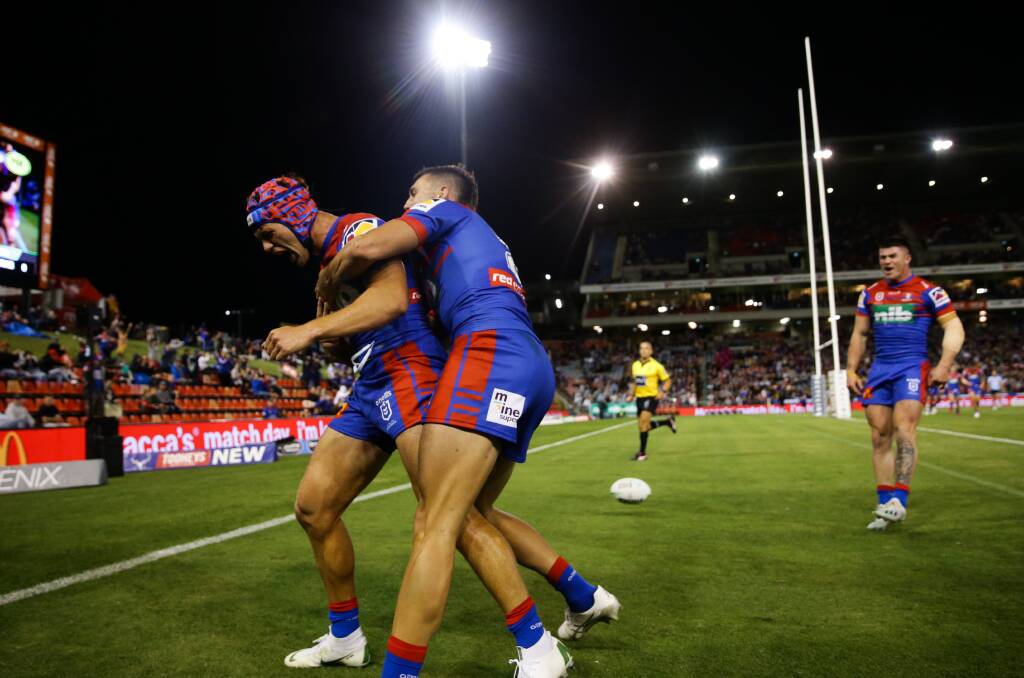 TRY: Kalyn Ponga and Brayden Musgrove celebrate a try in Newcastle's win against the Cronulla Sharks at McDonald Jones Stadium last month. Picture: Jonathan Carroll