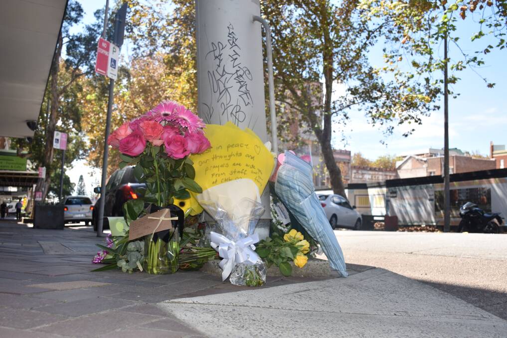 TRIBUTE: Flowers left at the Perkins Street intersection where cyclist Brigitte Maria Nilsen died last week after she was hit by a truck. Picture: Max McKinney
