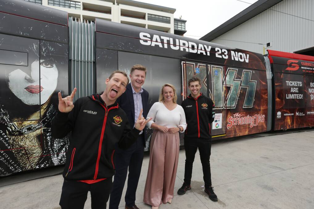 CRAZY TRAIN: David Reynolds, Supercars' Kurt Sakzewski lord mayor Nuatali Nelmes and Anton de Pasquale at Monday's unveiling. The light rail timetable will be expanded during the race and KISS concert. Picture: Simone De Peak