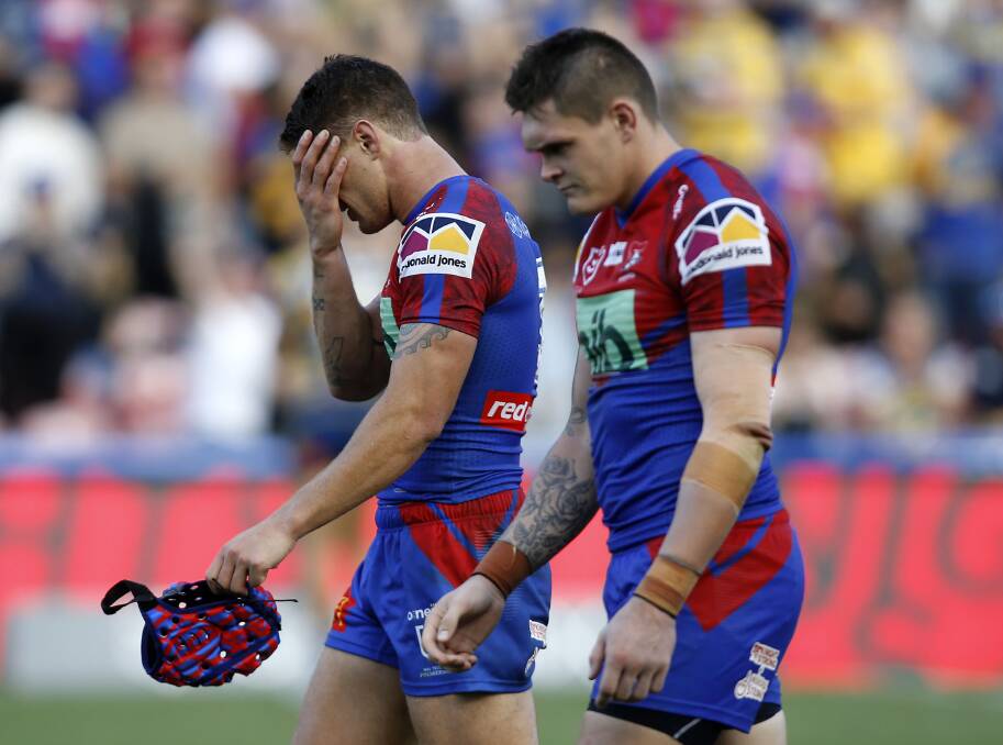 SORRY: Knights captain Kalyn Ponga and teammate Brodie Jones leave the field after Sunday's 39-2 loss to the Parramatta Eels. Picture: AAP