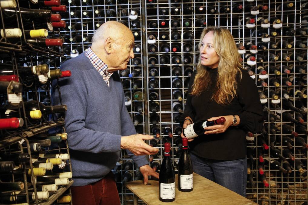 BIG DROP: James Halliday in his cellar with Langton's head of auctions Tamara Grischy. The celebrated wine writer is auctioning some of his personal collection. 