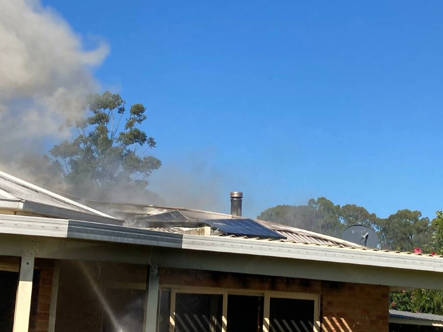SMOKE: Initial investigations indicate the fire may have begun in the solar panels on the home, Fire and Rescue NSW said. Picture: Fire and Rescue NSW
