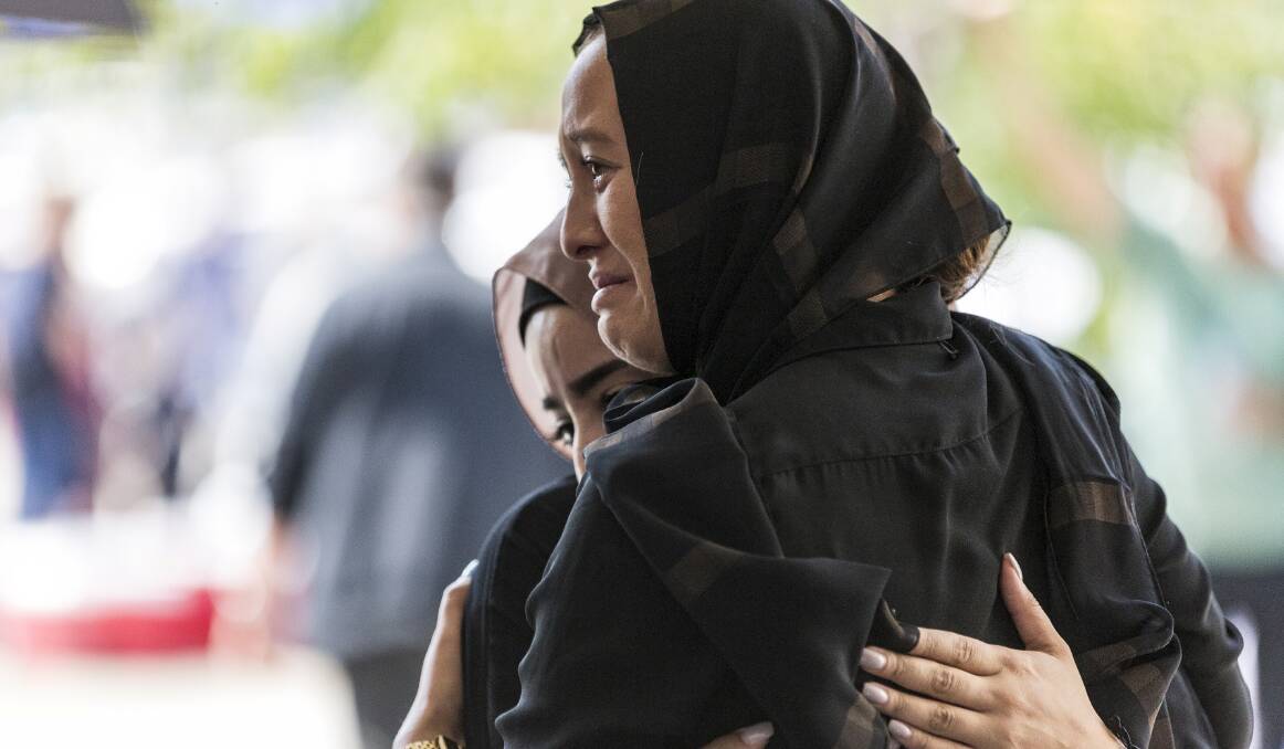 HEARTBREAK: Mourners in Christchurch. Reader Carmel Noonan argues that public discourse, including around refugees, has fed prejudices in Australia. Picture: AAP