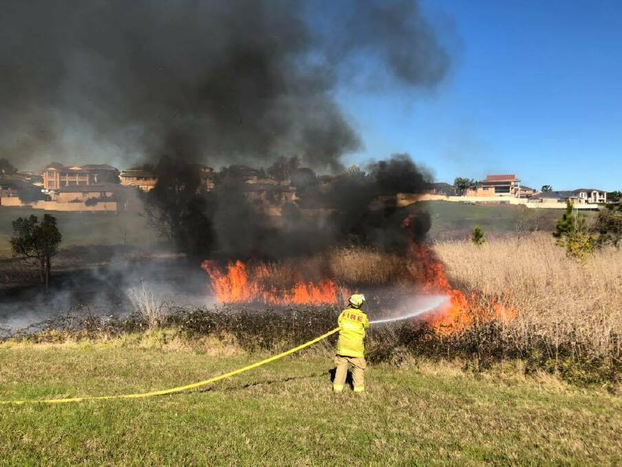 SMOKING OUT ANSWERS: Raymond Terrace firefighters have urged anyone who saw suspicious behaviour on Friday to contact police. Picture: Raymond Terrace Fire and Rescue