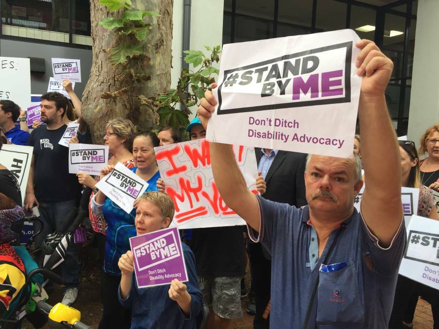  Speaking up: About 60 people rallied in Newcastle on Friday to call for the NSW government to overturn plans to cut funding to disability advocacy services.
