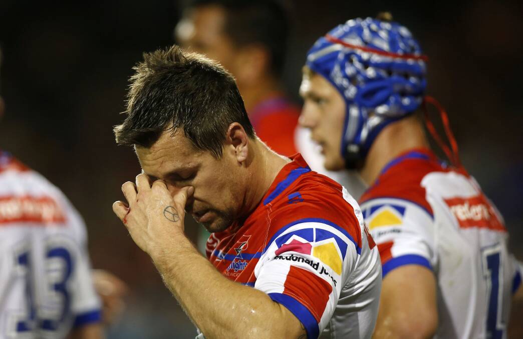 DOWNCAST: Knights captain Mitchell Pearce. Readers say the calibre of play in Saturday's loss to the Tigers falls short of the club's standards. Picture: Darren Pateman
