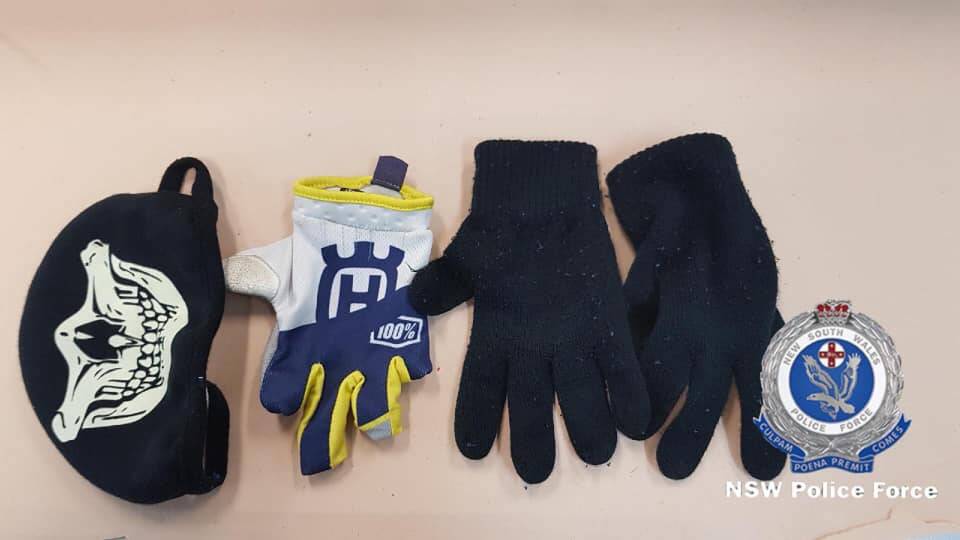 GLOVES: The face mask and extra gloves were also allegedly found when police searched the man's pockets. 