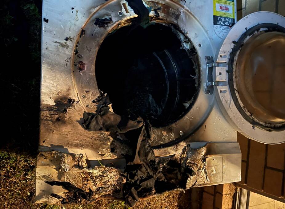 HOT CYCLE: The dryer where the fire began. Picture: Fire and Rescue NSW