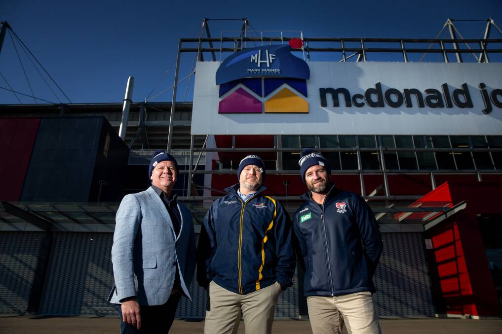 HAT'S THE WAY: Brett Lavaring from McDonald Jones Homes, stadium manager Dean Mantle and Danny Buderus. Picture: Marina Neil