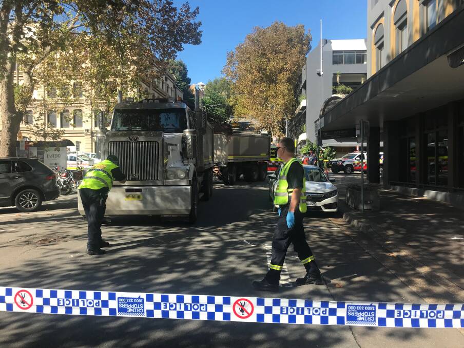 INVESTIGATING: Emergency services on Perkins Street after the incident this morning. Picture: Simone De Peak