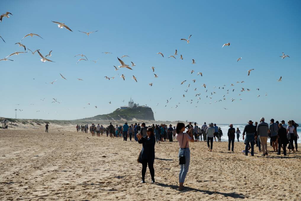 UP IN THE AIR: Protesters on Nobbys beach in May against seismic testing off Newcastle's coast. Greens senator Dr Mehreen Faruqi argues oil and gas exploration is not worth the risk to marine life and coastal environments. 