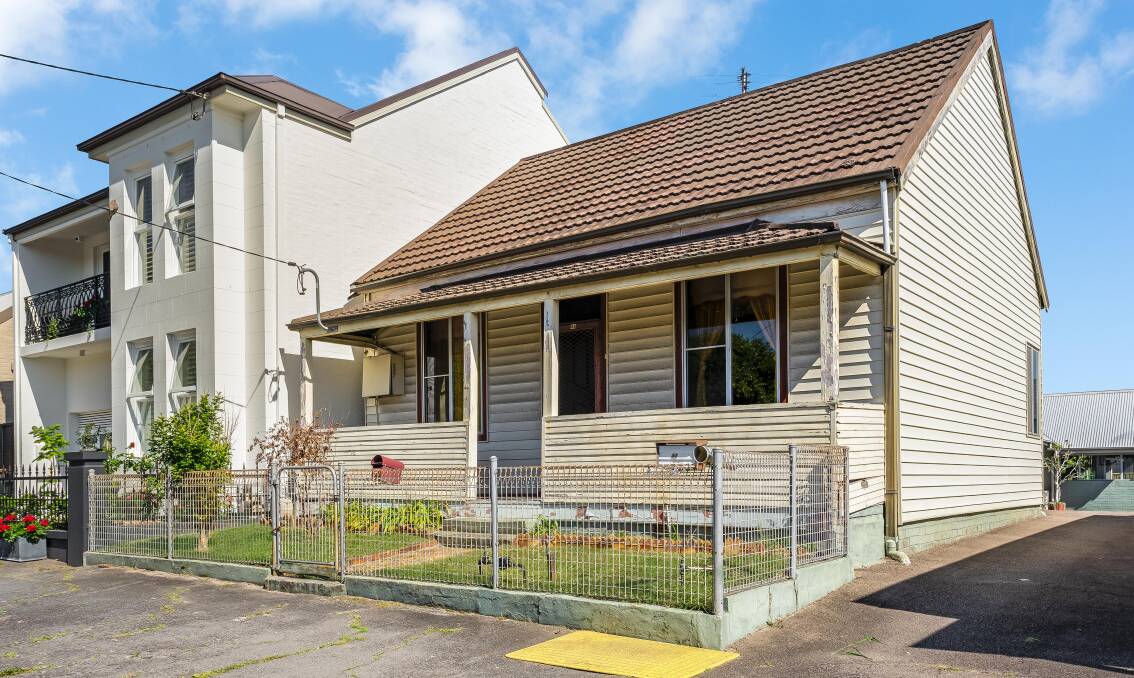 This Cooks Hill property comprises two freestanding homes on two separate lots and goes to auction on Saturday. 