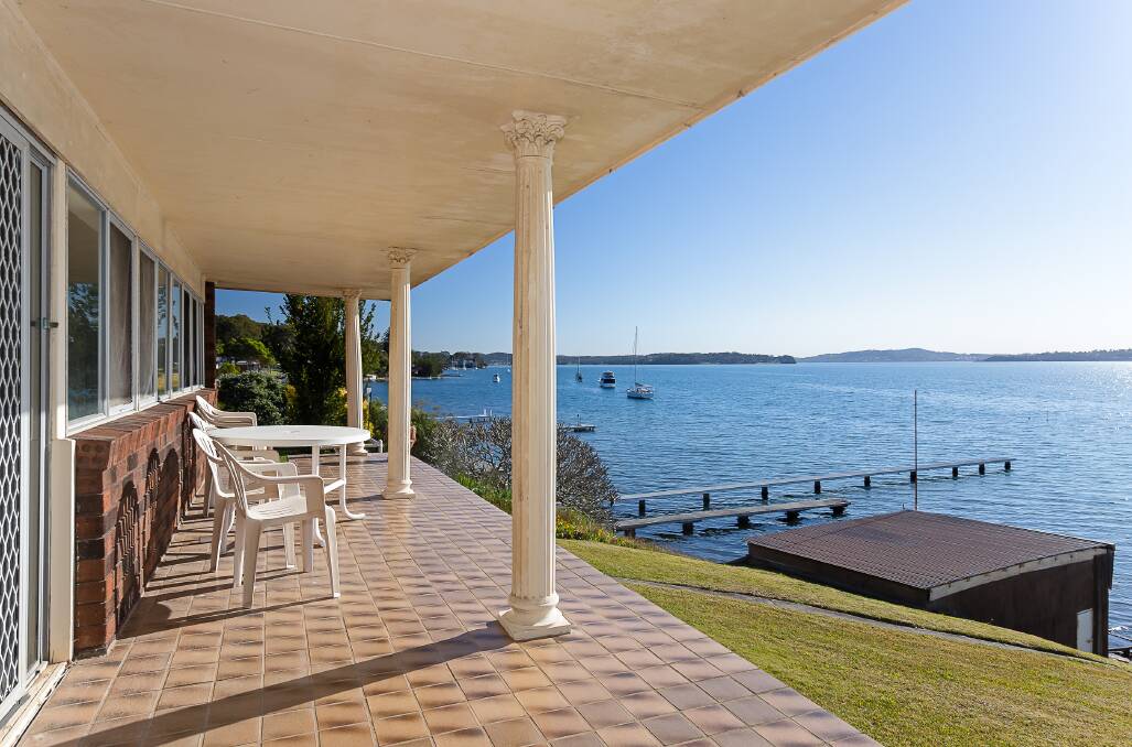 This waterfront home in Coal Point's Skye Point Road is set for auction on August 23.