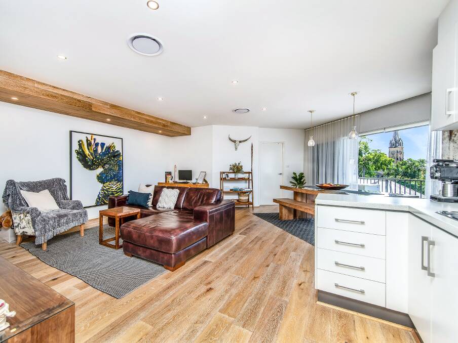 NO CITY LIMITS: This low-maintenance apartment with three bedrooms and two bathrooms in Cooks Hill offers privacy and a lifestyle of convenience.