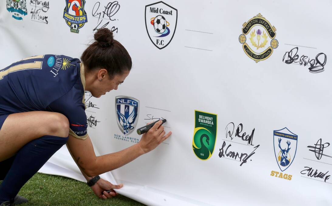 SUPPORT: New Lambton's Herald WPL captain Stacey Day signs the NNSWF mental health wellness pledge. Picture: Sproule Sports Focus