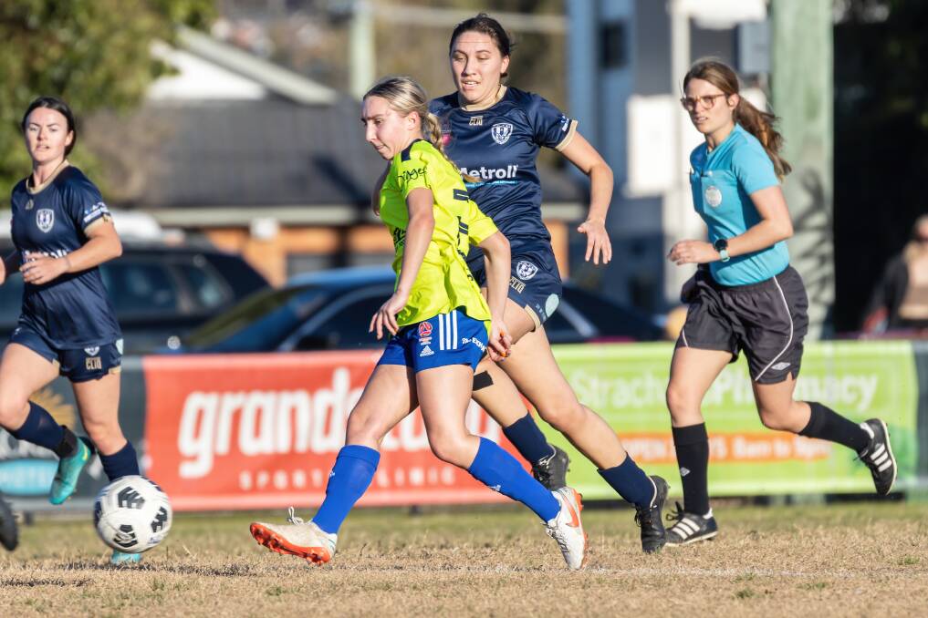Newcastle Olympic's Rosie Copus passes the ball in her first-grade starting debut against New Lambton last Saturday. Picture: Breathless Blue Photography