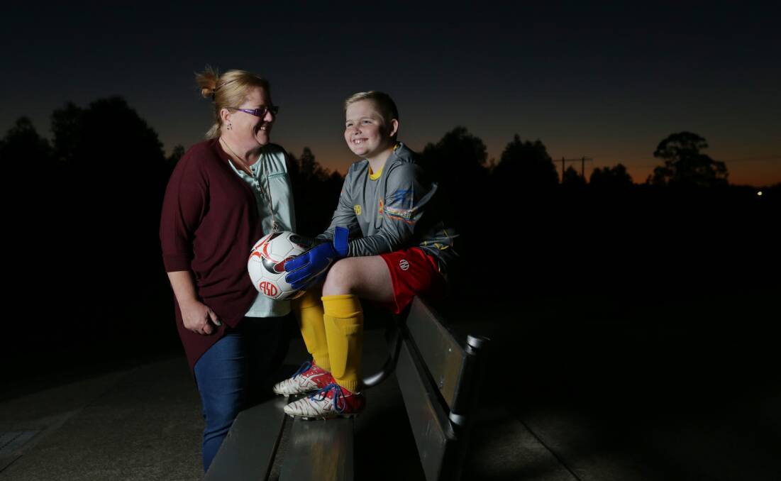 SPEAKING OUT: Janelle Riggs and 13-year-old son Lachie, who has Tourette Syndrome and plays for South Wallsend Junior Soccer Club, want to spread awareness about the medical condition. Picture: Simone De Peak