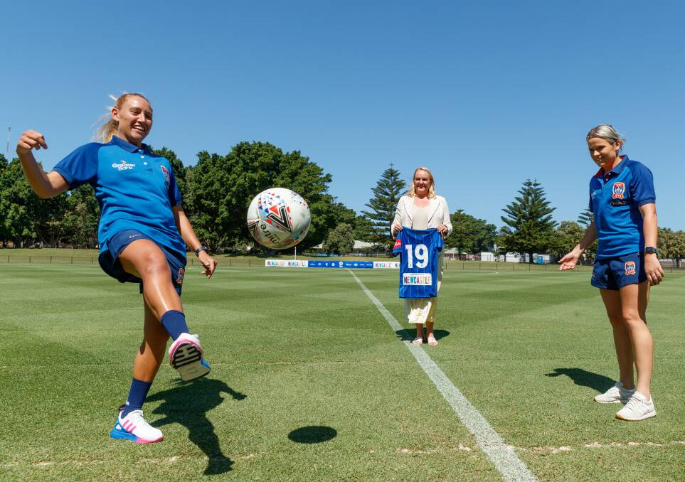 SUPPORT: Newcastle lord mayor Nuatali Nelmes watches Jets Gema Simon, left, and Cassidy Davis in action. Picture: Max Mason-Hubers
