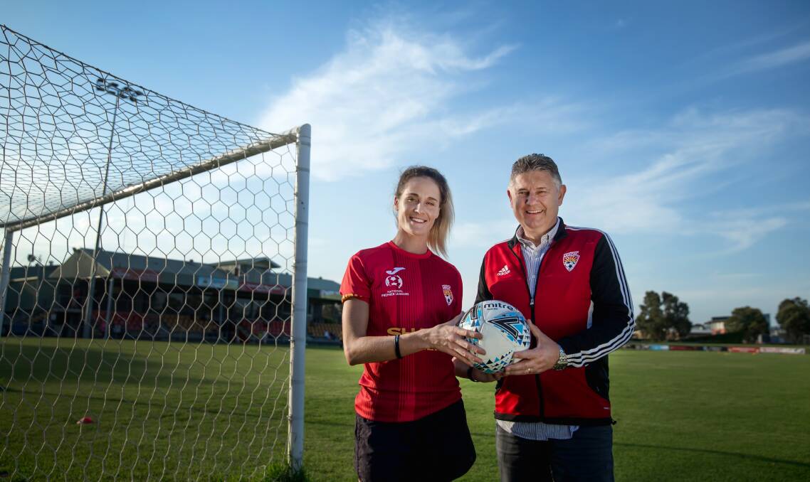 NEW MOVE: Herald Women's Premier League player Gabrielle Brodie with Broadmeadow Magic Football Club president Steven Foteff. Picture: Marina Neil