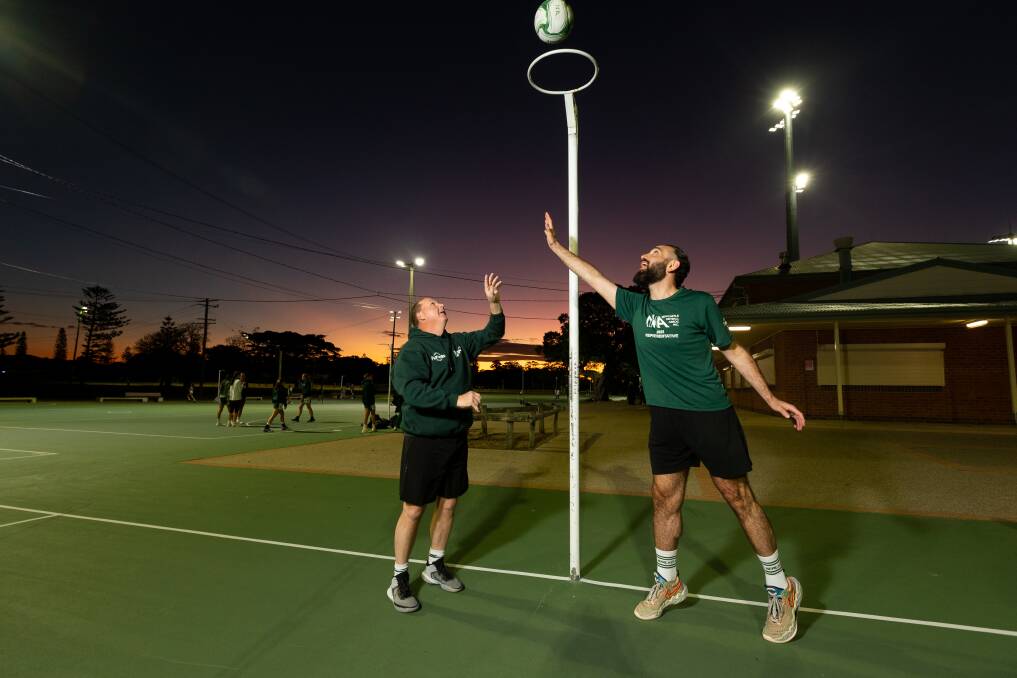 Newcastle open men's team players Wayne Lee, left, and Steven Sefo, right, at National Park netball courts. Picture by Jonathan Carroll