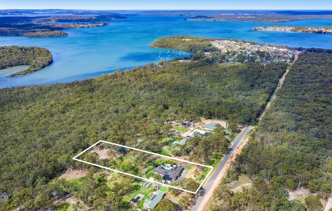 LAKESIDE ACREAGE: The auction sale of this Wyee Point property has set a new sale price high for the Lake Macquarie suburb.