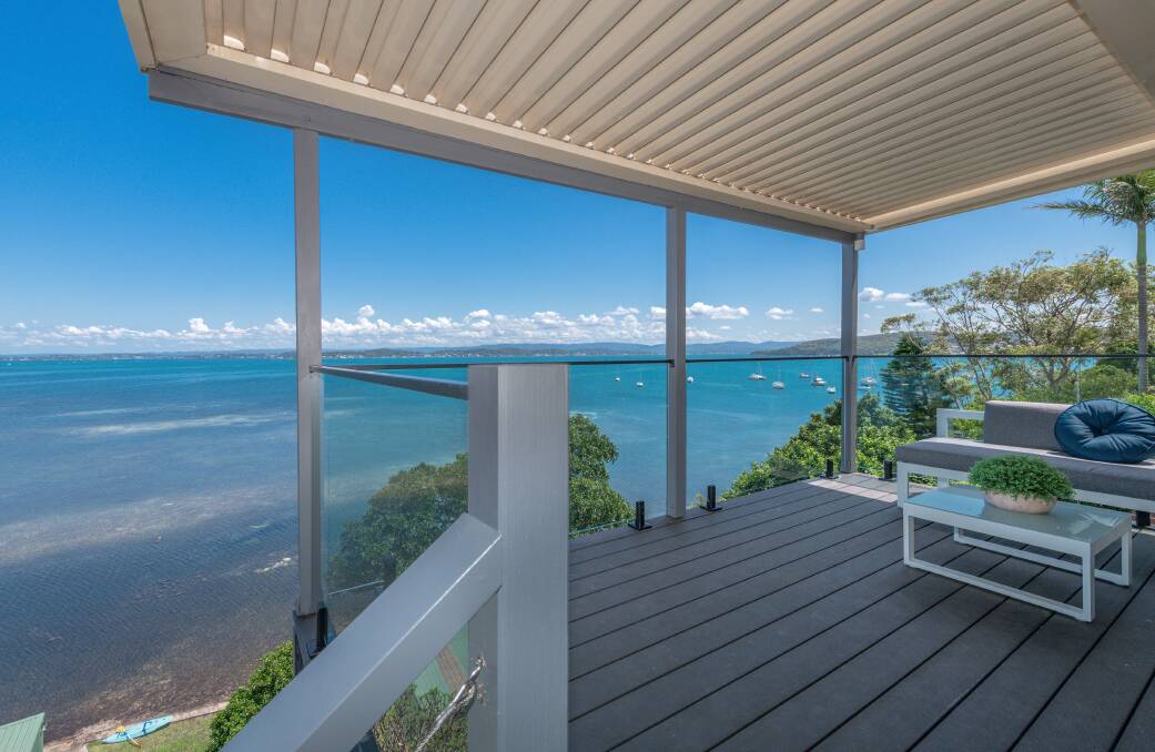 WHAT A VIEW: This Belmont property is perched high above Lake Macquarie and is being marketed with a guide of $2.15 million to $2.35 million.