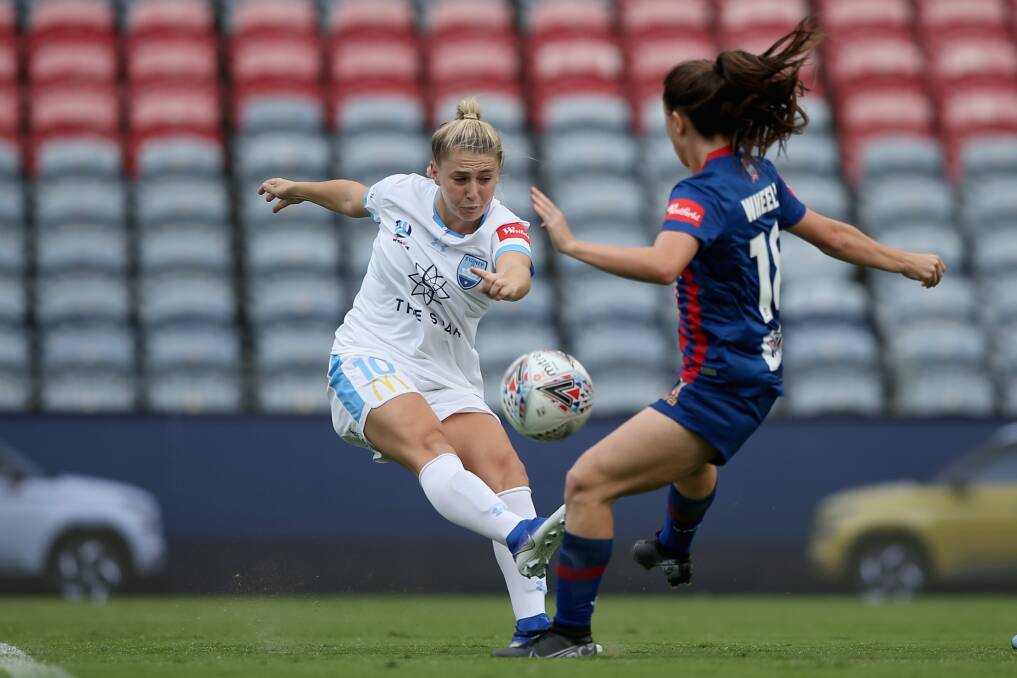 DOUBLE: Newcastle's Clare Wheeler, right, and Sydney goalscorer Remy Siemsen contest the ball at McDonald Jones Stadium on Sunday. Picture: Getty Images