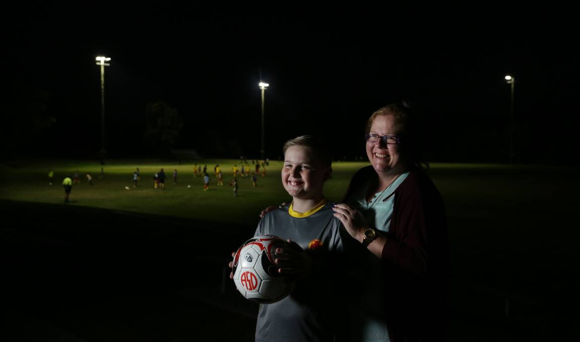 Janelle Riggs and 13-year-old son Lachie, who has Tourette Syndrome and plays for South Wallsend Junior Soccer Club, want to spread awareness about the medical condition. Picture: Simone De Peak