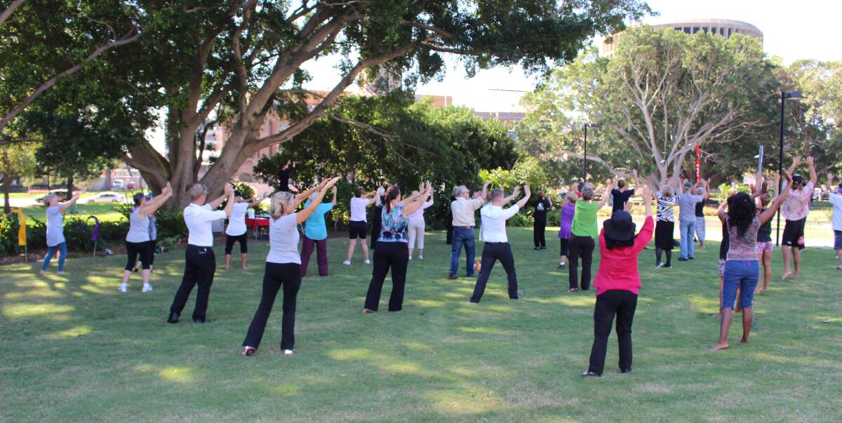 AS ONE: Community members take part in a free event at Civic Park last year for World Tai Chi and Qigong Day, which involves people around the world coming together to share a common vision of hope and healing. 
