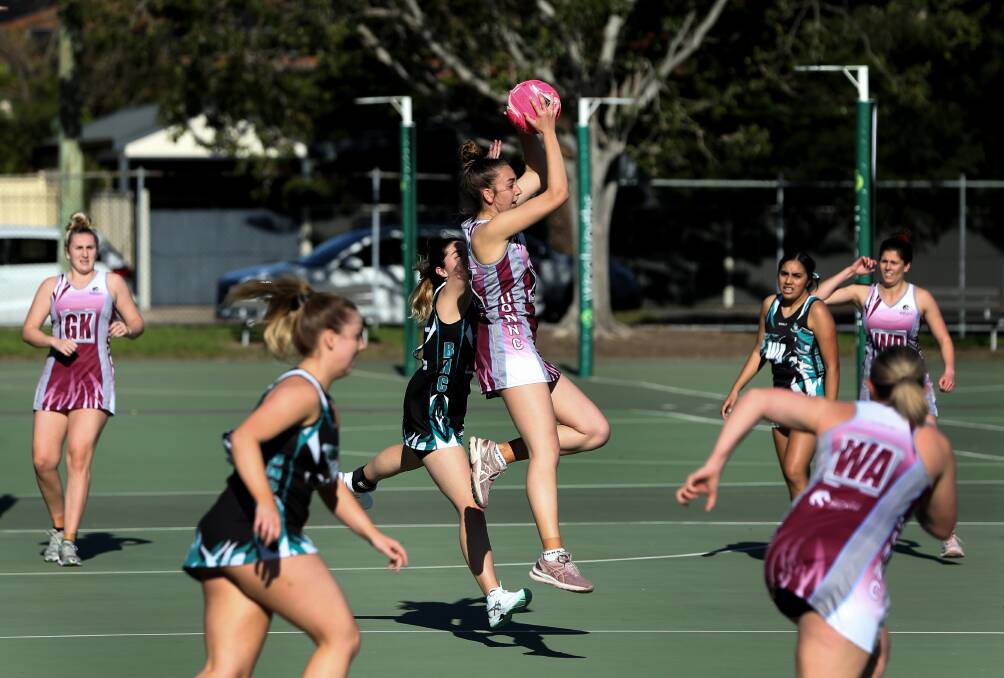 Action from BNC Whanau v University of Newcastle in round one of Newcastle netball championship on Saturday. Pictures by Marina Neil