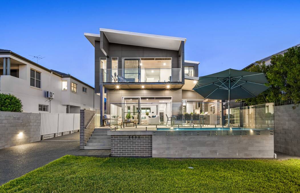 RECORD MARK: The $2.15 million sale of this luxury residence overlooking Lake Macquarie has raised the roof for Warners Bay.