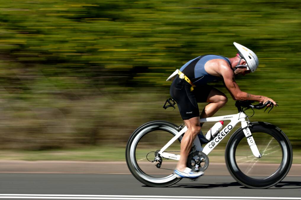 BACK FOR MORE: Pelican's Nathan Stewart, pictured on his way to winning the 2009 Sparke Helmore Triathlon. The multiple winner will be chasing glory again on Sunday. Picture: Ryan Osland