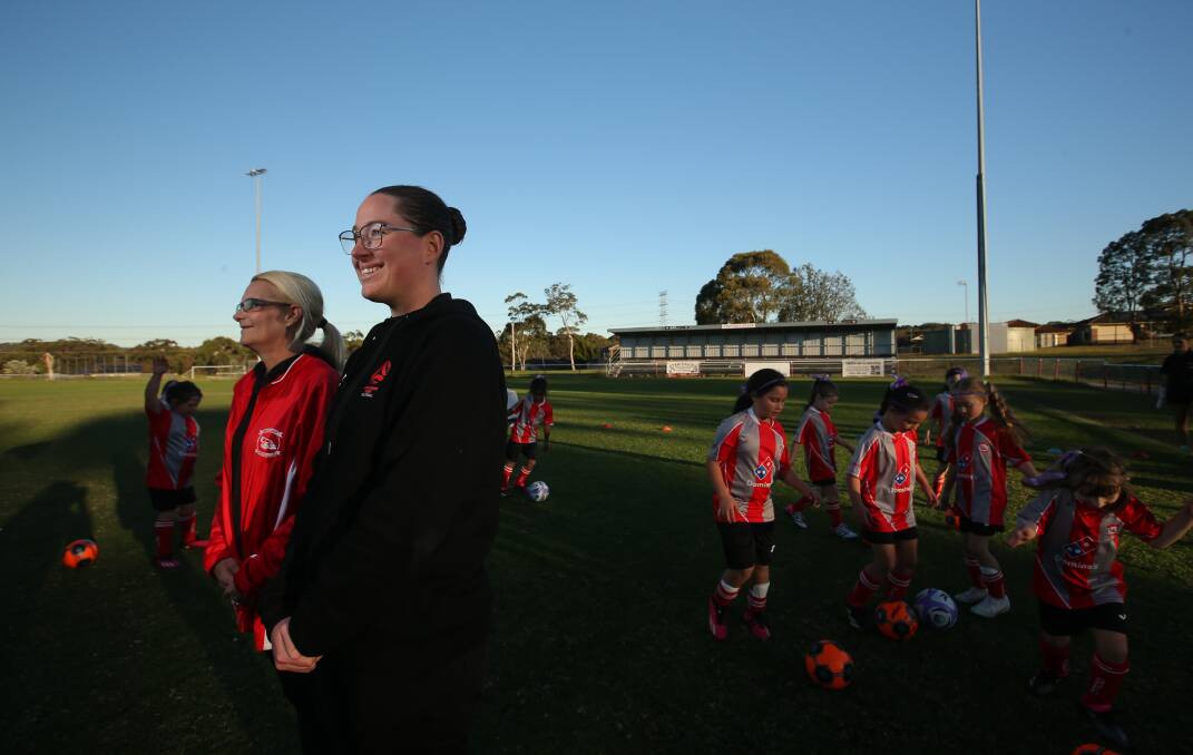 South Cardiff Community Football Club's Rebecca Sinclair, left, and general manager of NSW Football Legacy Annelise Rosnell , at an under-seven girls clinic at Ulinga Oval on Monday. Picture by Simone De Peak
