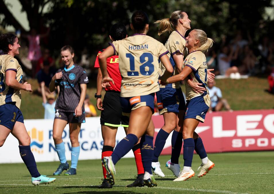 Libby Copus-Brown, right, celebrates a Newcastle Jets goal with Emily van Egmond this season. Picture by Peter Lorimer