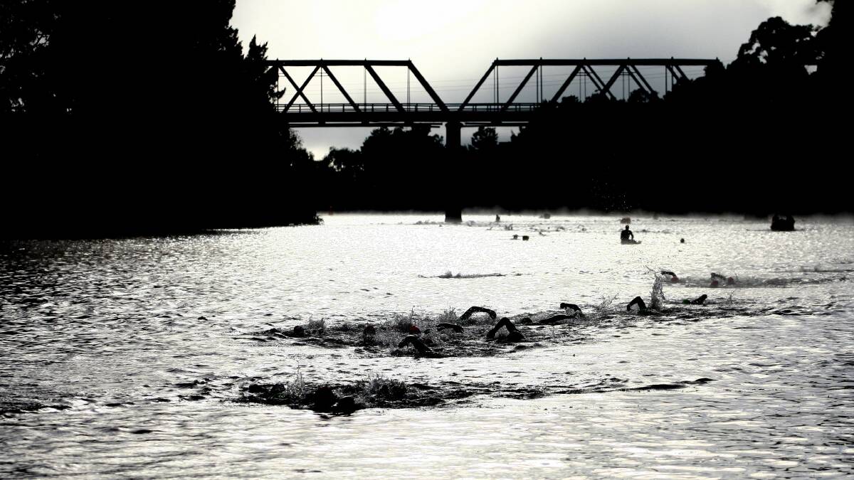 LONG-RUNNING: Swimmers during one of the early Maitland Triathlon events. It is staged out of Morpeth and has been running for 22 years. Picture: Ryan Osland