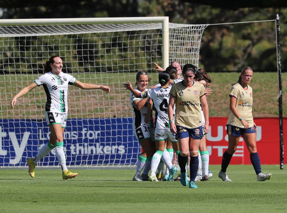 Western United celebrate one of their six goals against Newcastle at No.2 Sportsground on Sunday. Picture by Peter Lorimer