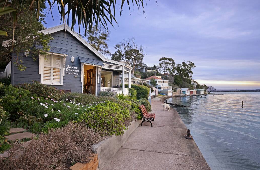 ICONIC: Selby Cottage on the shores of Lake Macquarie has been sold. The circa 1900 miners cottage has been used as holiday accommodation and forms part of a unique property.