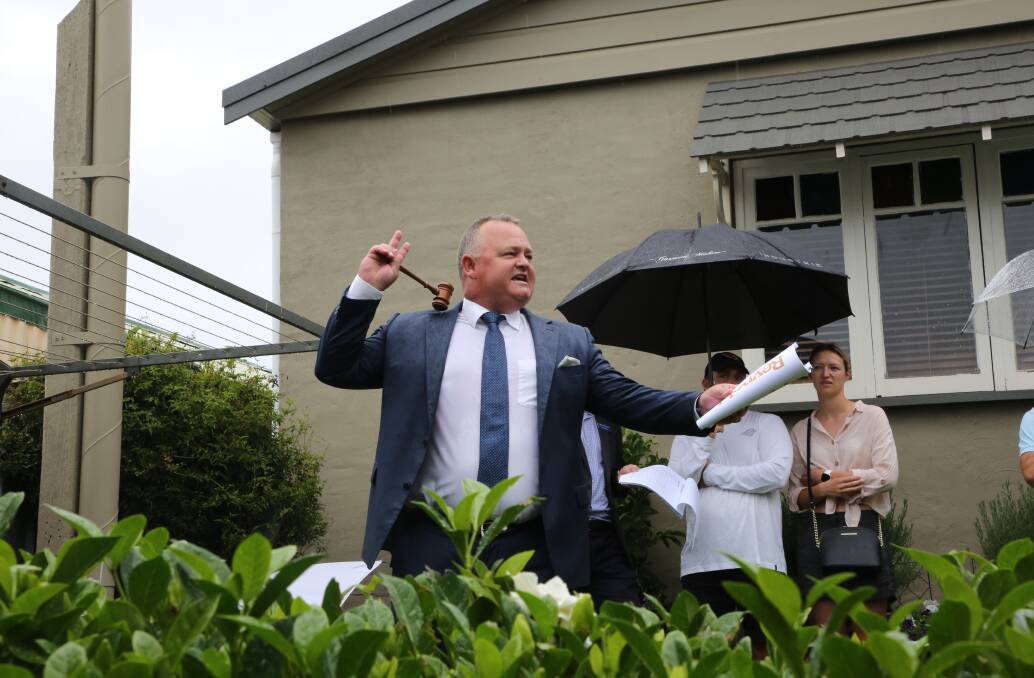 Auctioneer Luke Jones, of Reynolds Auctions, controls proceedings at 16 Clarence Road, New Lambton on February 13.