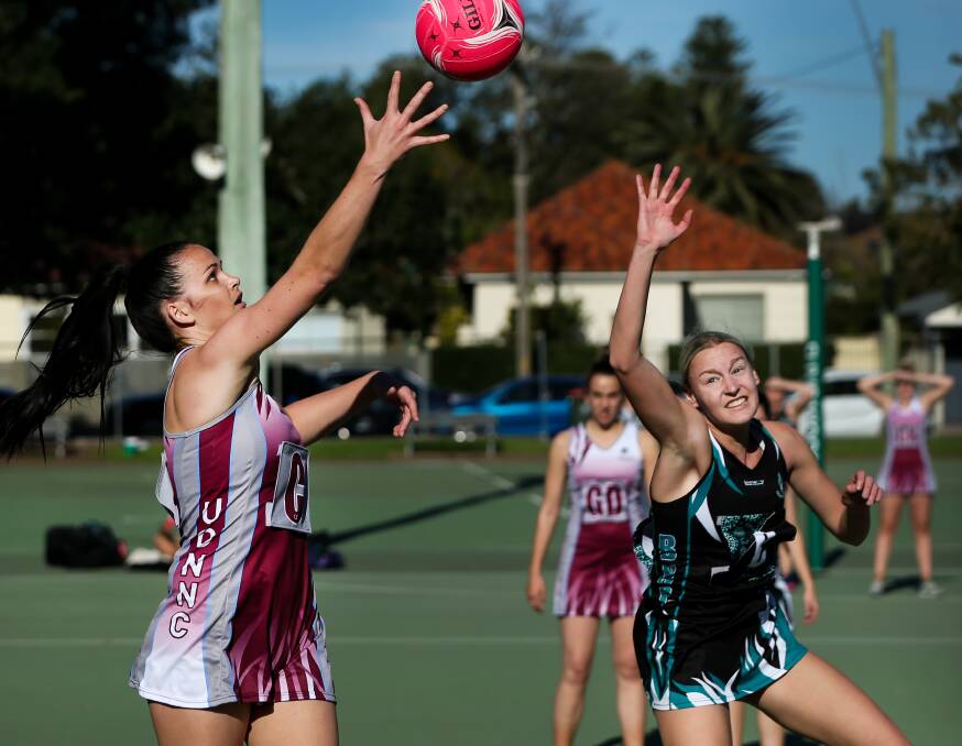 BNC's Claudia Rodwell, right, in action during the 2020 Newcastle championship netball season. Picture: Marina Neil