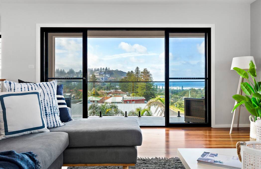 VERSATILE: The view from the main residence of a Redhead property which features a three-bedroom main residence with a studio plus a separate three-bedroom home. They are separated by a heated indoor pool.