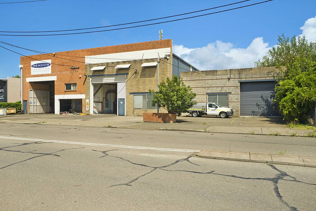 LONG-TERM TENANT: This Broadmeadow property comprises three workshops each with separate roller door access.