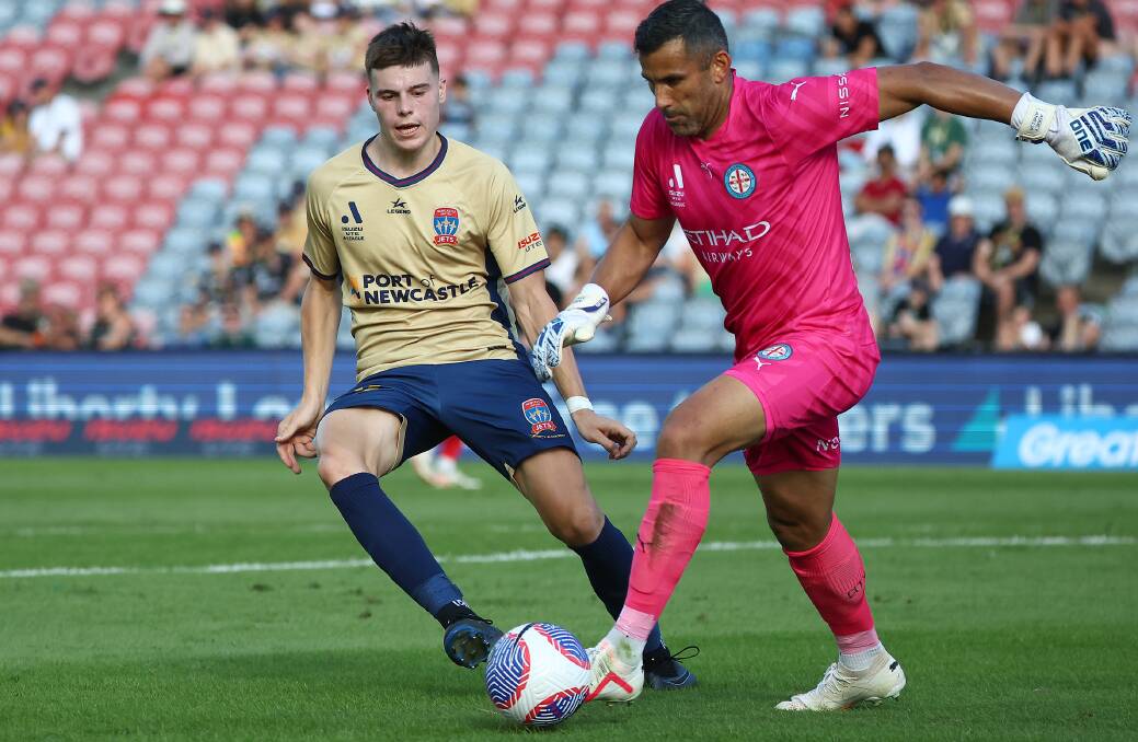 Newcastle Jets rookie Justin Vidic, in his A-League debut, puts pressure on Melbourne City goalkeeper Jamie Young. Picture Getty Images