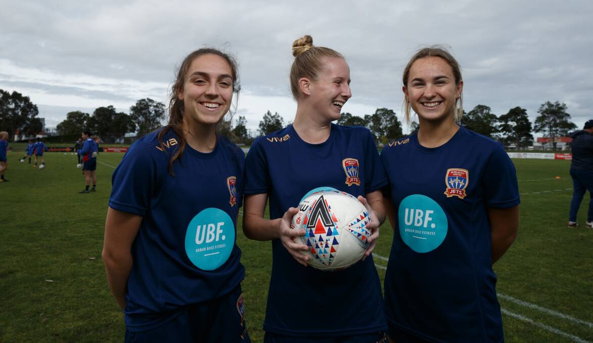 ALL SMILES: Paige Kingston-Hogg, right and pictured last season with Jets teammates Tessa Tamplin and Renee Pountney, is soaking up her W-League experience. Picture: Max Mason-Hubers