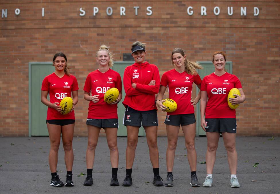 Swans Academy coach Kate Handley (middle) with Newcastle players, from left, Asha Turner-Funk., Molly Simpson, London Ashcroft and Taylor Joyce. Picture: Marina Neil
