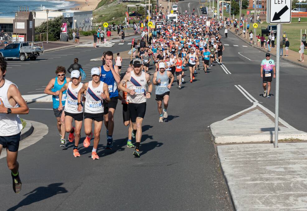 LEAD ROLE: Maitland twins Liam (1469) and Monty Dixon (1468) set the pace in a large Hill2Harbour 10-kilometre field on Sunday and fought it out for first place. Picture: Lee Pigott