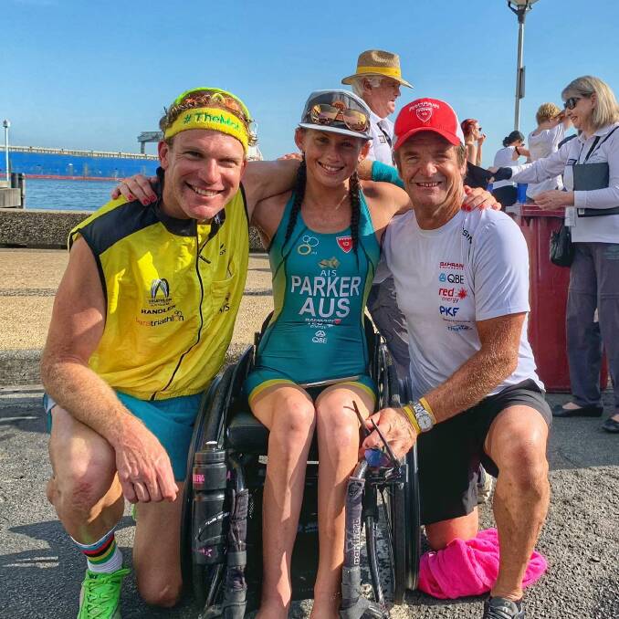 Lauren Parker with handler Dave Robertson, left, and best friend and training partner Brad Fernley in Newcastle after winning the 2020 City of Newcastle Paratriathlon. Parker thanked her support network after securing a silver medal at the Tokyo Paralympics on Sunday. Picture: Facebook