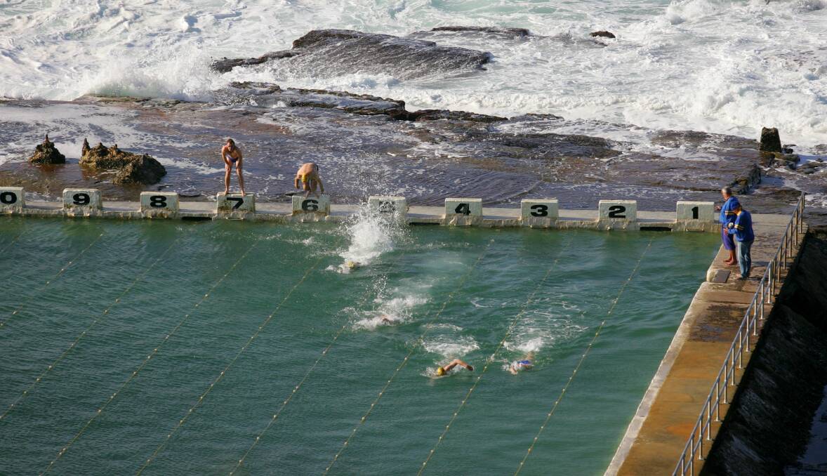 TAKE THE PLUNGE: The Merewether Mackerels meet Sunday mornings to swim at Merewether Ocean Baths from May until September. Picture: Dean Osland