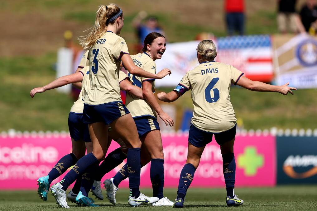 Newcastle Jets swarm hat-trick hero Sarah Griffith at Tamworth's Scully Park on Saturday. Picture by Getty Images
