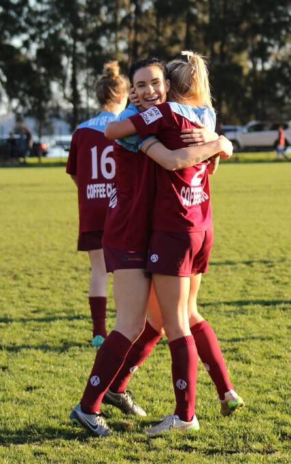 ECSTATIC: Warners Bay players Adriana Jones and Airlie Davis celebrate their win over Merewether which put them into this weekend's WPL grand final.